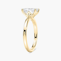 Delicate Four-Prong Emerald Cut Solitaire Engagement Ring