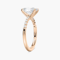 Oval Cut Shared Prong Side Stone Engagement Ring