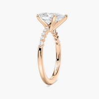 Pear Shaped Shared Prong Side Stone Engagement Ring