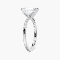 Emerald Cut Shared Prong Side Stone Engagement Ring