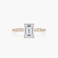 Emerald Cut Shared Prong Side Stone Engagement Ring