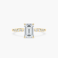 Emerald Cut Shared Prong Side Stone Engagement Ring