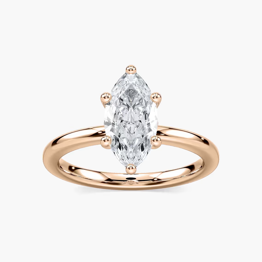 Delicate Four-Prong Marquise Cut Solitaire Engagement Ring