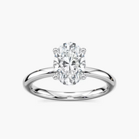 Delicate Four-Prong Oval Solitaire Engagement Ring