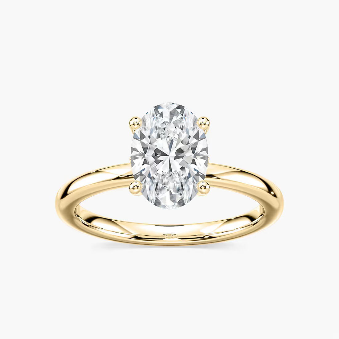 Delicate Four-Prong Oval Solitaire Engagement Ring