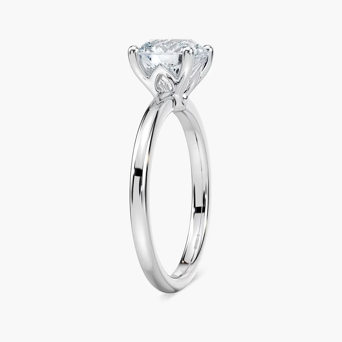 Delicate Four-Prong Round Cut Solitaire Engagement Ring