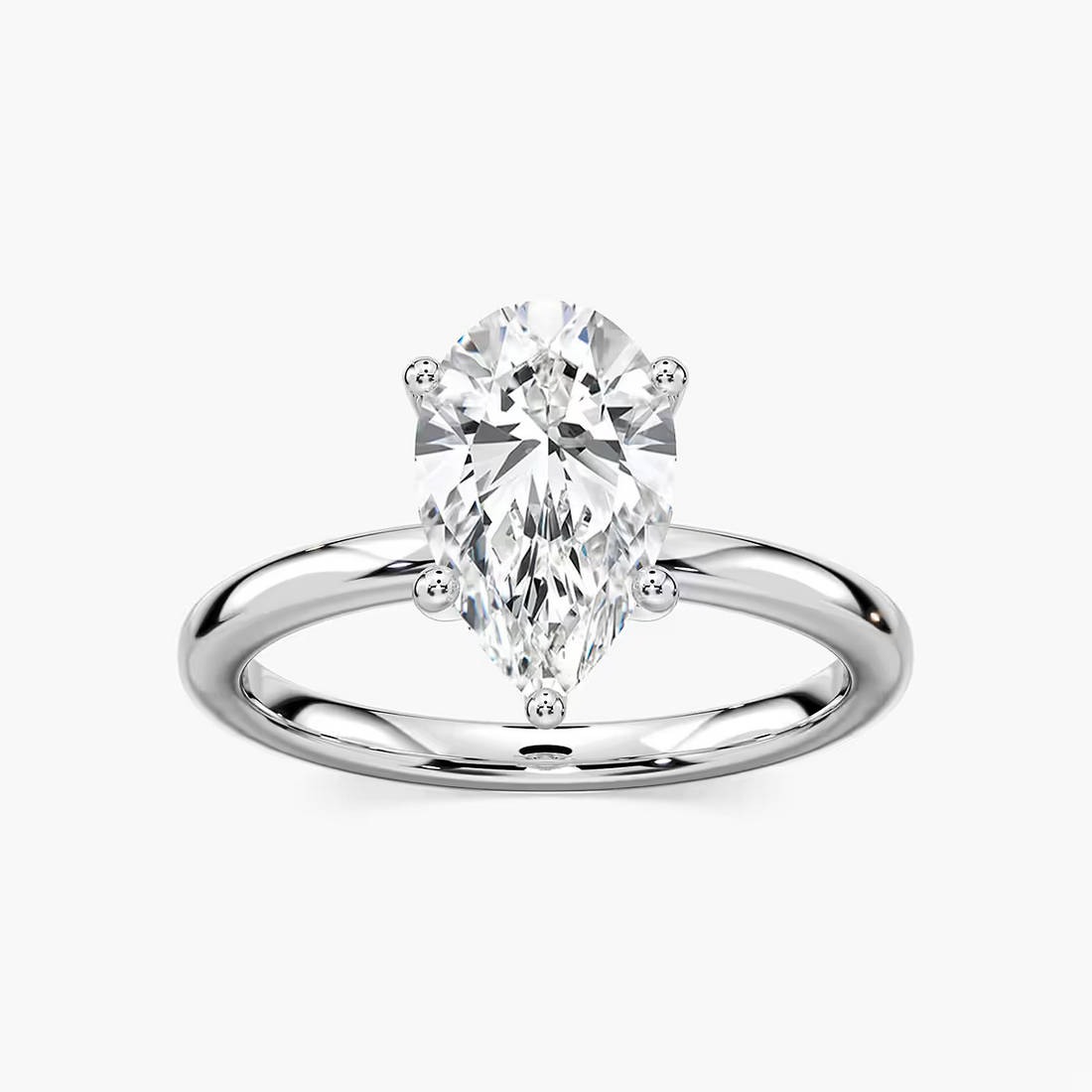 Delicate Four-Prong Pear Shaped Solitaire Engagement Ring