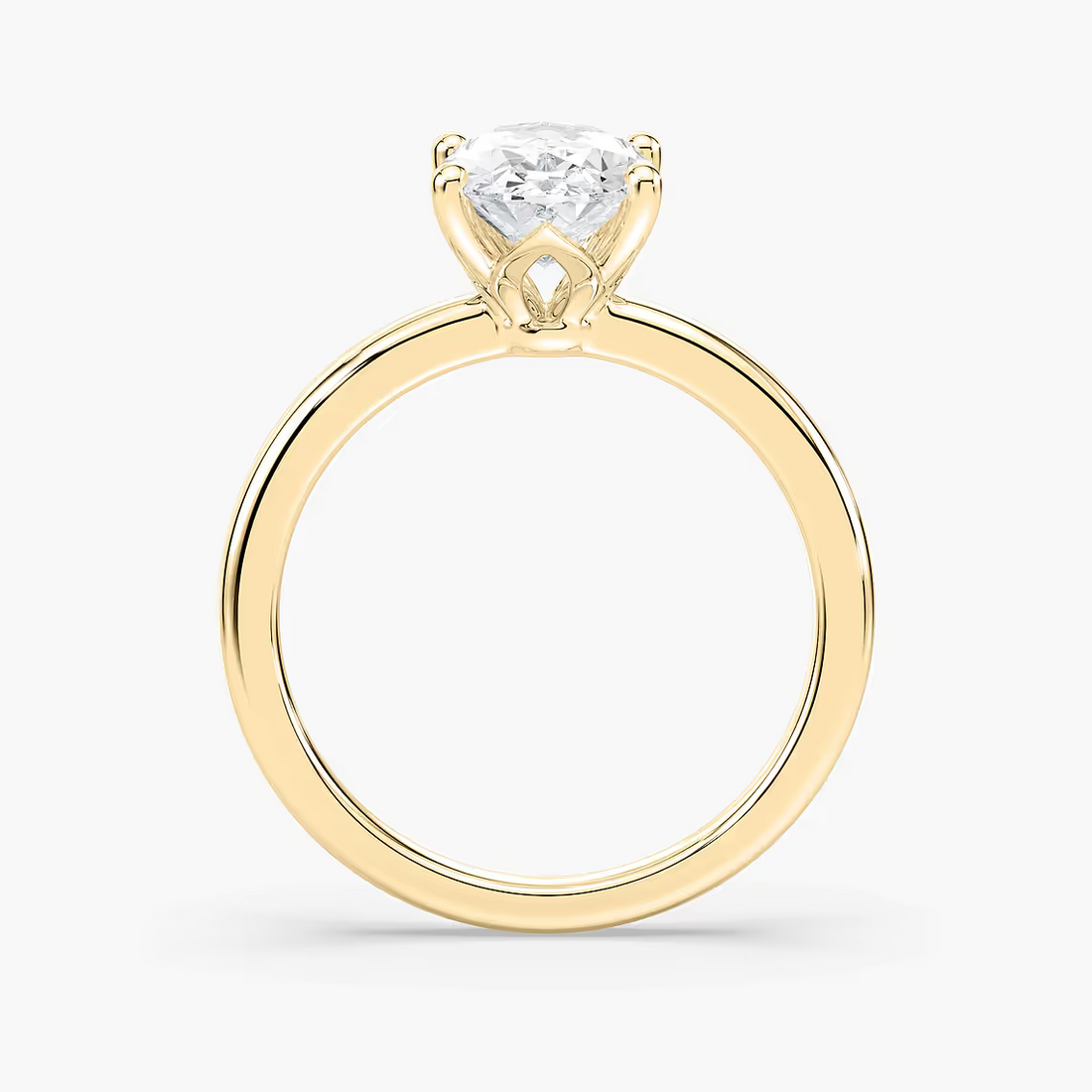 Delicate Four-Prong Oval Solitaire Engagement Ring