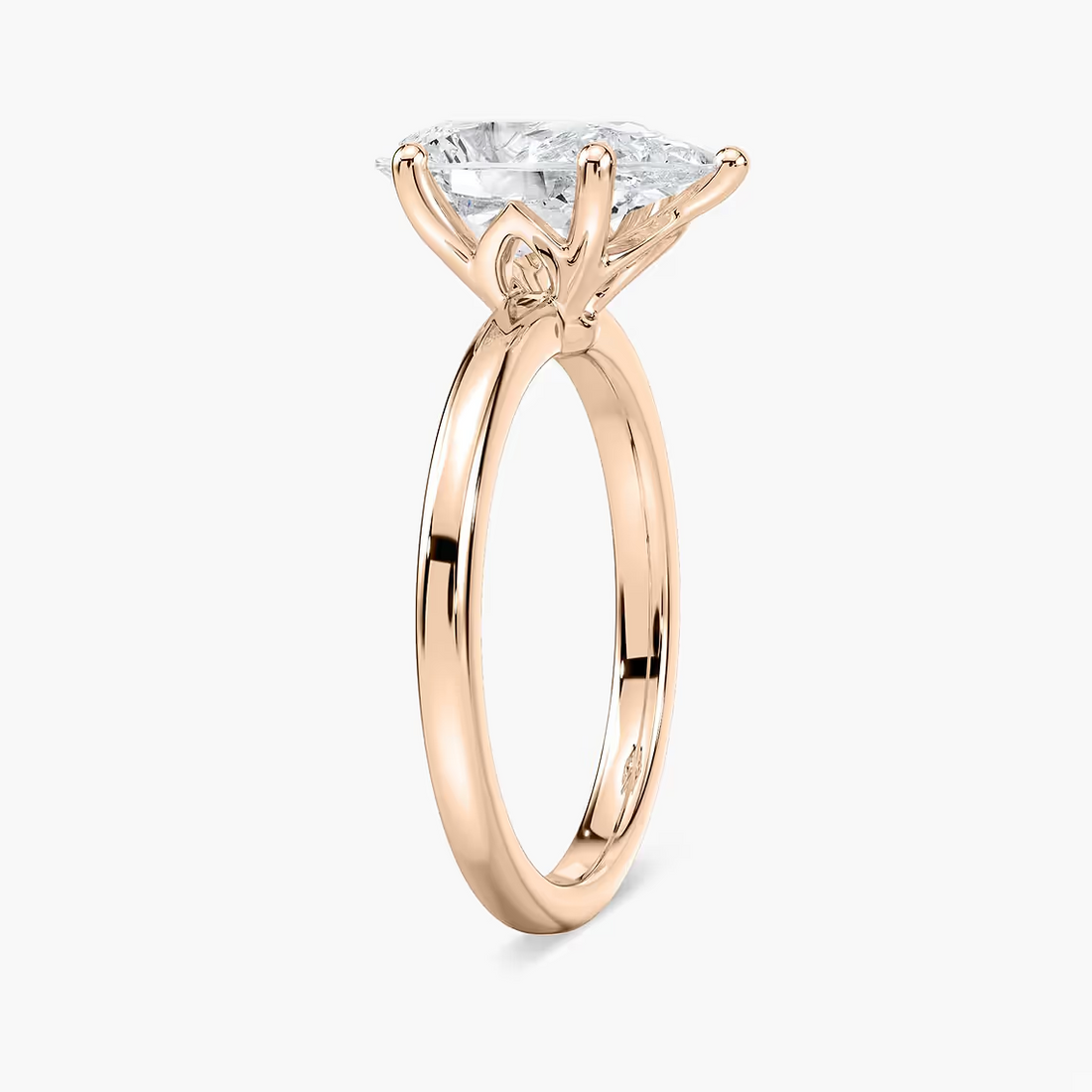 Delicate Four-Prong Pear Shaped Solitaire Engagement Ring