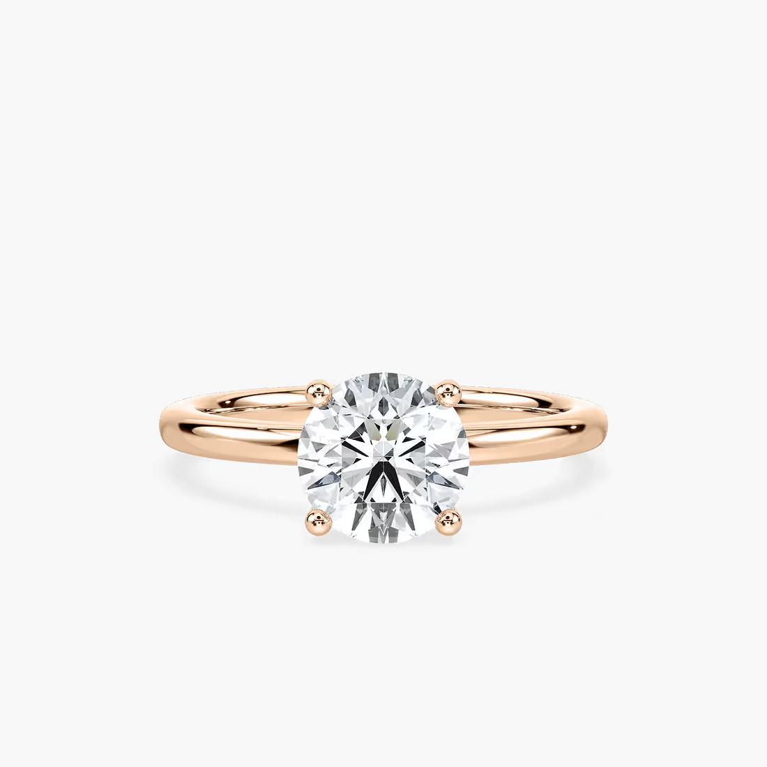 Delicate Four-Prong Round Cut Solitaire Engagement Ring
