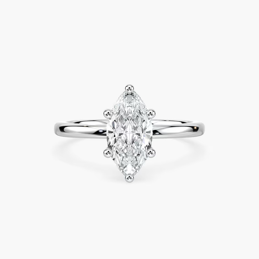 Delicate Four-Prong Marquise Cut Solitaire Engagement Ring