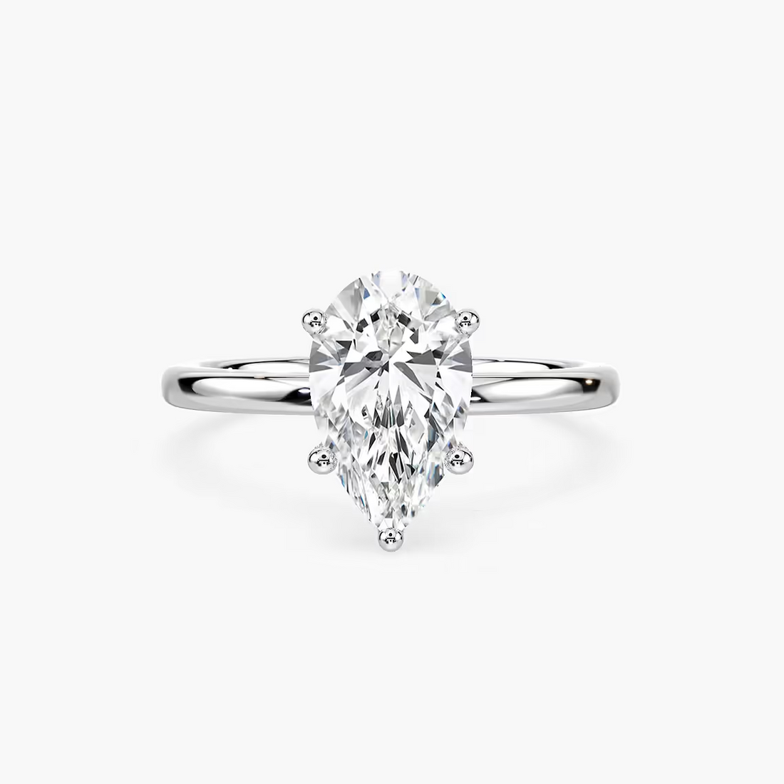 Delicate Four-Prong Pear Shaped Solitaire Engagement Ring